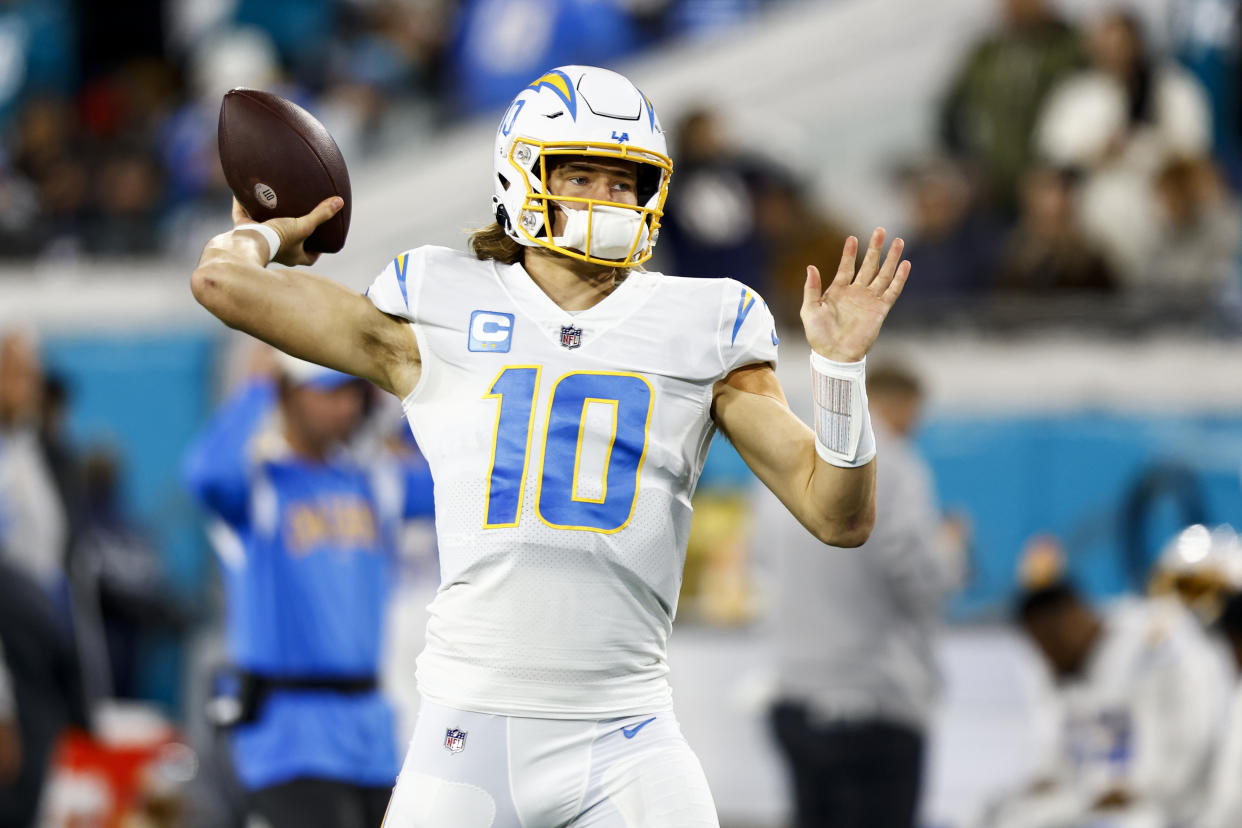 Justin Herbert of the Los Angeles Chargers warms up prior to an NFL game on Jan. 14, 2023. (Kevin Sabitus/Getty Images)