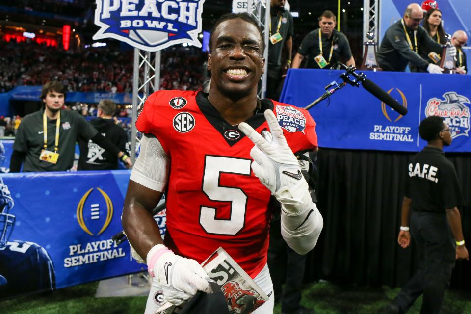 Georgia Bulldogs defensive back Kelee Ringo (5) celebrates after a victory against the Ohio State Buckeyes in the 2022 Peach Bowl at Mercedes-Benz Stadium.