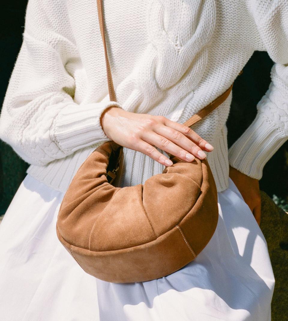 <p>Can you imagine your favorite pastry as a handbag? Well, that dream of ours has been brought to life. Soft-leather bags with subtle folds that come in round shapes are exactly what we ordered. So good you'll want to take a bite.</p>