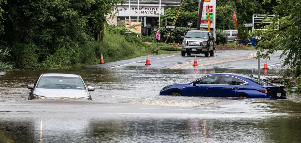 Route 202 in Yorktown, N.Y., was flooded Monday after torrential storms led to flash flooding and at least one fatality in New York's Hudson Valley.