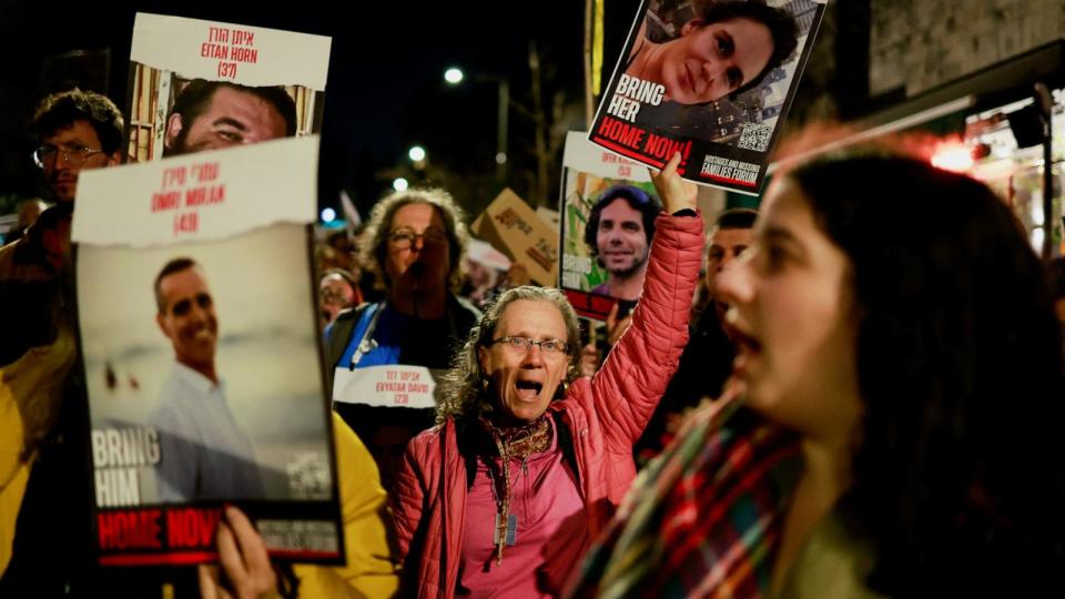 PHOTO: Families of hostages and supporters hold signs during a protest to call for the immediate release of hostages outside Israeli Prime Minister Benjamin Netanyahu's residence, in Jerusalem, Jan. 22, 2024.  (Ammar Awad/Reuters)