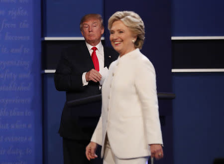 Donald Trump and Hillary Clinton finish their third and final presidential debate at UNLV in Las Vegas, Nevada. REUTERS/Mike Blake