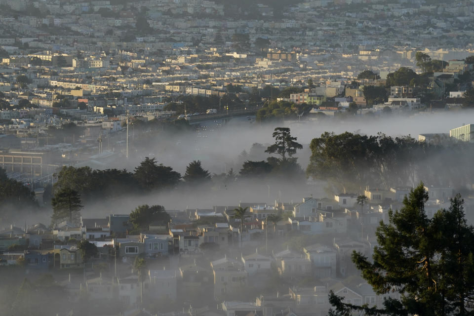 FILE - In this Oct. 20, 2020, file photo low-lying morning fog is shown over San Francisco. Rising inflation is expected to lead to a sizeable increase in Social Security's annual cost-of-living adjustment, or COLA, for 2022. Exactly how much will be revealed Wednesday morning after a Labor Department report on inflation during September, a data point used in the final calculation. (AP Photo/Jeff Chiu, File)