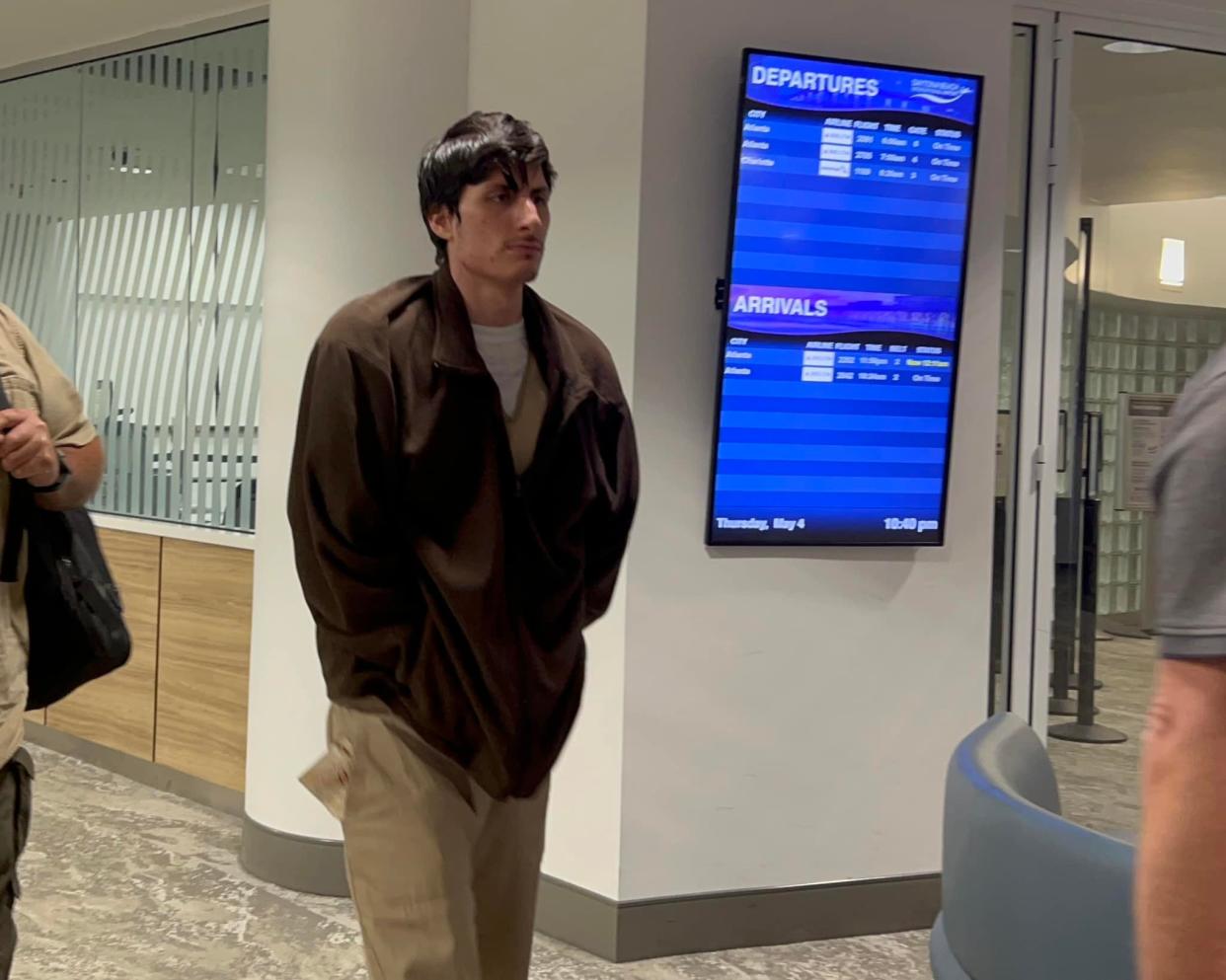 Cristhian Zapata, 23, of Connecticut, arrives at Daytona Beach International Airport on Thursday, May 4. Zapata is one of three men charged in recent months with threatening Volusia Sheriff Mike Chitwood.