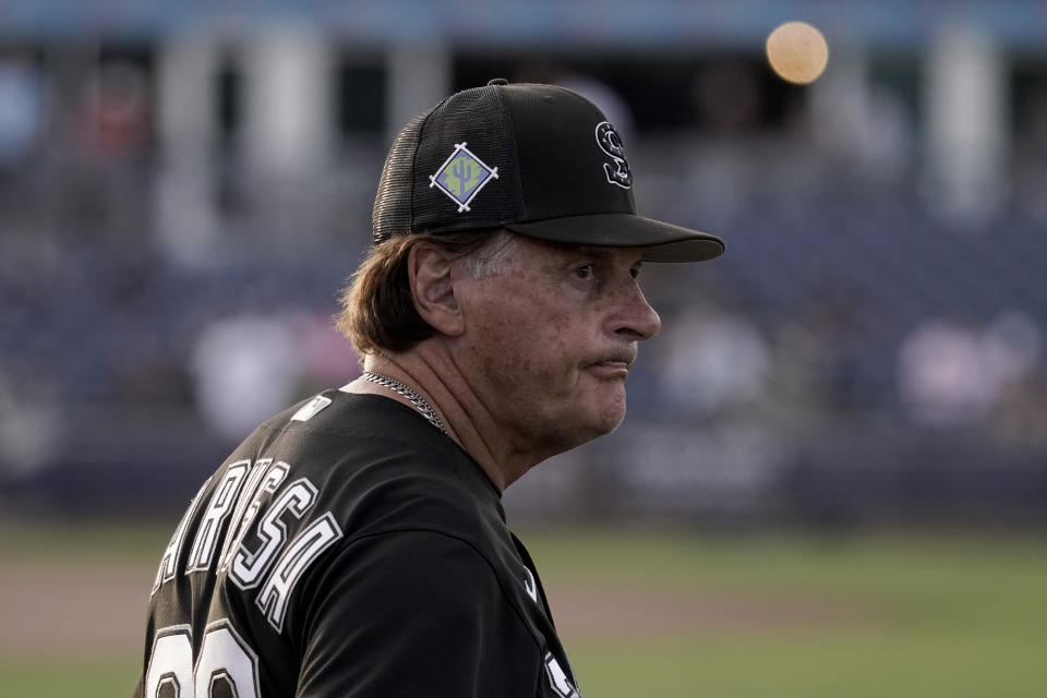 Chicago White Sox manager Tony La Russa watches players warmup before a spring training baseball game against the Seattle Mariners Friday, March 25, 2022, in Peoria, Ariz. (AP Photo/Charlie Riedel)