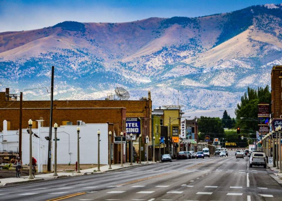 Route 50 in Ely with mountain range in the background.