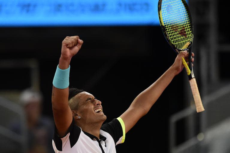 Nick Kyrgios of Australia celebrates his victory over Roger Federer of Switzerland during the Madrid Open, at the Caja Magica (Magic Box) sports complex, on May 6, 2015