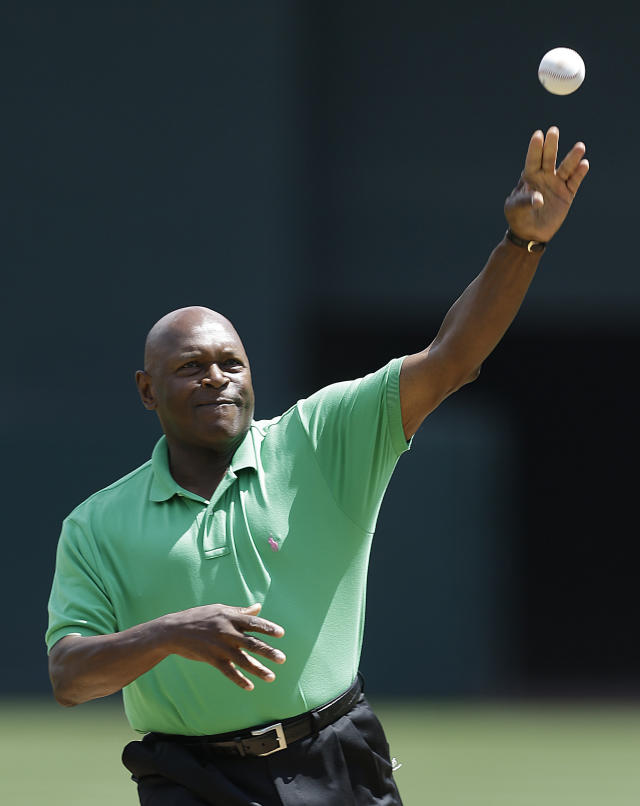 FILE - Former Oakland Athletics pitcher Vida Blue throws out the ceremonial first pitch prior to the baseball game against the Los Angeles Angels, July 27, 2013, in Oakland, Calif. Blue, a hard-throwing left-hander who became one of baseball's biggest draws in the early 1970's and helped lead brash Oakland Athletics to three straight World Series titles, has died. He was 73. The A's said Blue died Saturday, May 6, 2023 but did not give a cause of death. (AP Photo/Ben Margot, file)