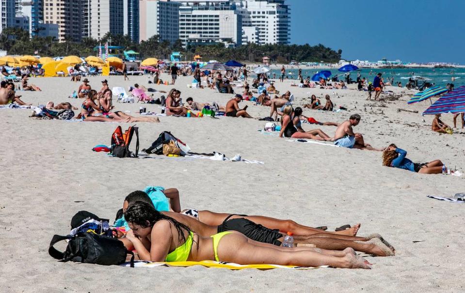 Beach goers enjoy South Beach on March 2, 2021. One year after Miami Beach shut down spring break, the tourists are back and hotels are at 70% occupancy.