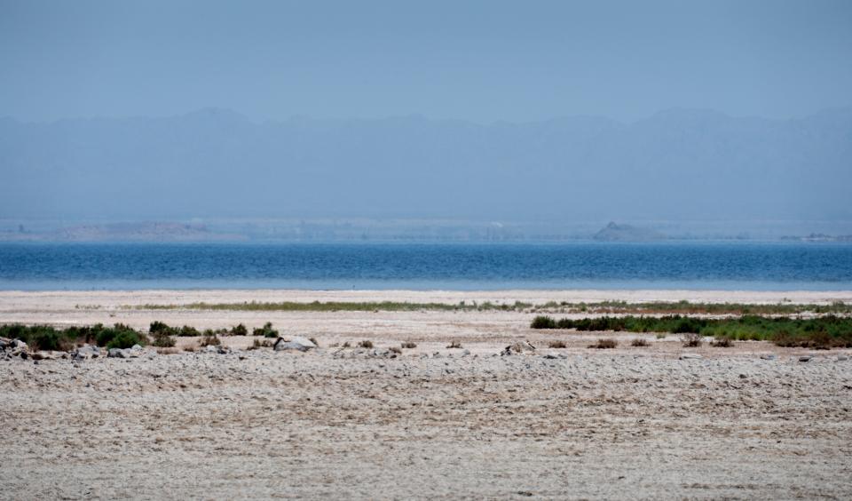 The Salton Sea as seen on May 18, 2022, from a ridge on the Elmore Company farm in Brawley, California. The waterbody is a product of the Imperial Valley’s used Colorado River water, and is shrinking.