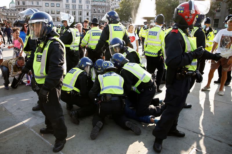 People gather in Trafalgar Square to protest against the lockdown imposed by the government, in London