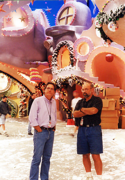 Michael Corenblith and Terry Scott stand on the whimsical wintery set of How the Grinch Stole Christmas (2000).