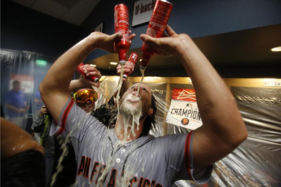 Bumgarner warms up in the beer garden with two bottles before getting serious with four cans. (AP)