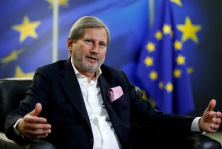 FILE PHOTO: European Neighbourhood Policy and Enlargement Negotiations Commissioner Johannes Hahn speaks during an interview with Reuters in Brussels, Jan. 18, 2018. REUTERS/Francois Lenoir/File Photo