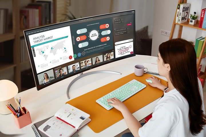 A woman using the LG UltraWide 40WP95C-W 5K monitor.