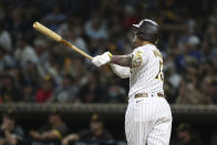 San Diego Padres' Manny Machado watches his home run against the Oakland Athletics during the fifth inning of a baseball game Tuesday, July 27, 2021, in San Diego. (AP Photo/Derrick Tuskan)