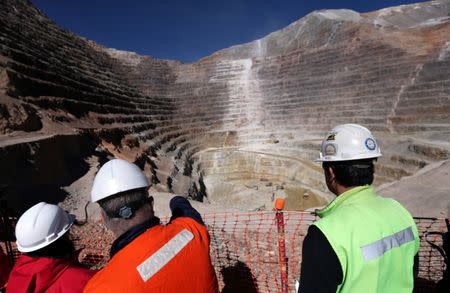 Workers stand next to an open pit at Barrick Gold Corp's Veladero gold mine in Argentina's San Juan province, April 26, 2017. REUTERS/Marcos Brindicci