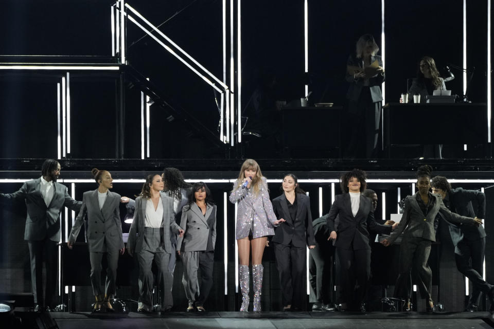 Taylor Swift, center, performs during the opener of her Eras tour on Friday, March 17, 2023, at State Farm Stadium in Glendale, Ariz. (AP Photo/Ashley Landis)