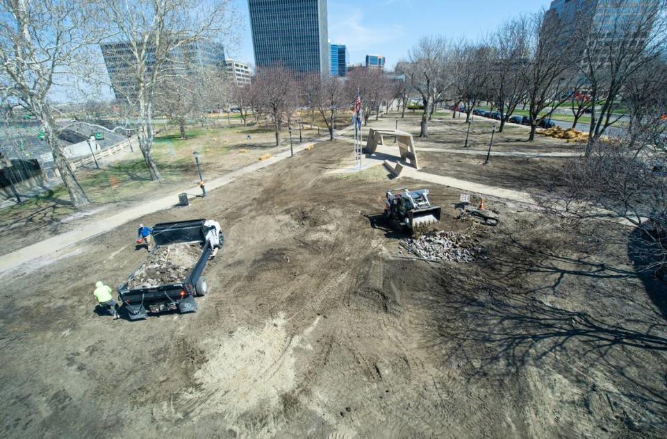 A work crew prepared the lawn of Washington Square Park on Wednesday for new sod.