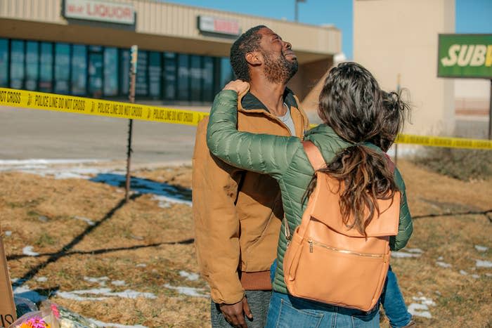 Kara Too hugs Joshua Thurman, who was inside the club during the attack, at the growing memorial outside Club Q on Nov. 20, 2022, in Colorado Springs, Colorado.