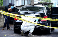 Inspectors examine the car owned by Lotte Group Vice Chairman Lee In-won at a police station in Yangpyeong, South Korea, August 26, 2016 Park Jung-ho/News1 via REUTERS