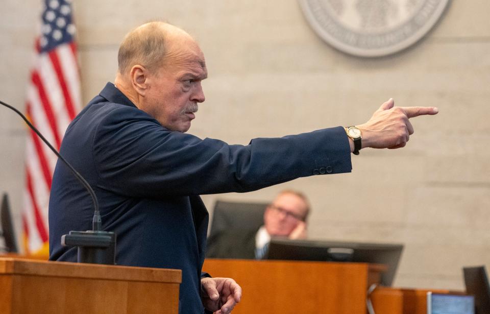 Special prosecutor Tim Merkle mimics the former Franklin County Sheriff's deputy Jason Meade's testimony that Casey Goodson Jr. was waving a gun as he drove his car as he makes his closing arguments Wednesday in Meade's murder trial in county Common Pleas Court.