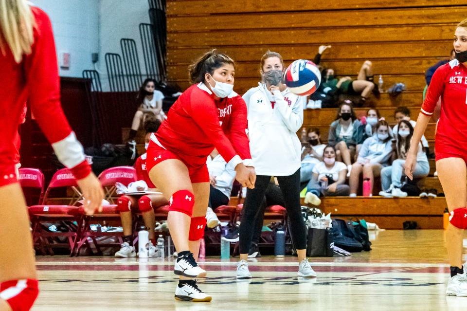 New Bedford's Nellyanee Medina Santiago digs the serve from Dartmouth.