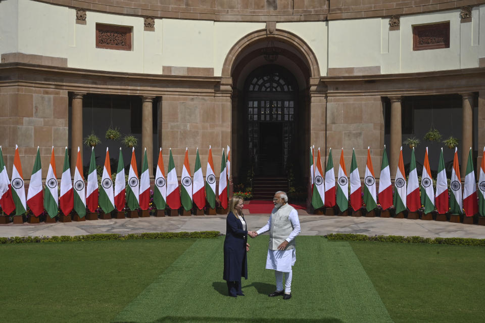 Italian Premier Giorgia Meloni, left, and Indian Prime Minister Narendra Modi, pose for the media before their meeting in New Delhi, India, Thursday, March 2, 2023. (AP Photo)