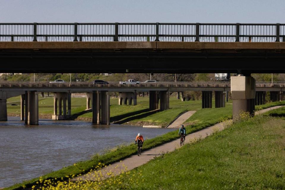 Cyclists ride through Trinity Trails near East 4th Street & South Sylvania Avenue in Fort Worth on Saturday, March 18, 2023. The city is estimated to begin construction in December for new bicycle lanes in the neighborhood.