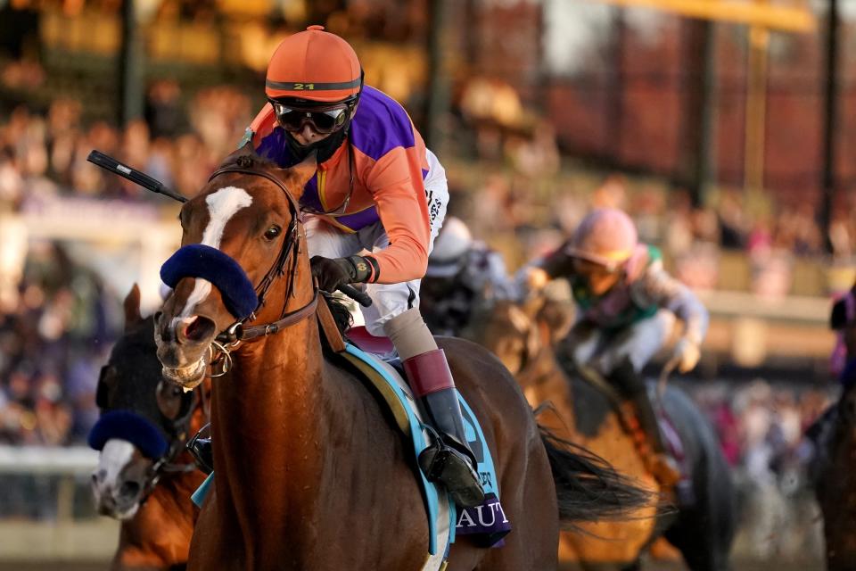 John Velazquez (9) rides Authentic to win the Breeder's Cup Classic horse race at Keeneland Race Course, in Lexington, Ky., Saturday, Nov. 7, 2020. (AP Photo/Darron Cummings)