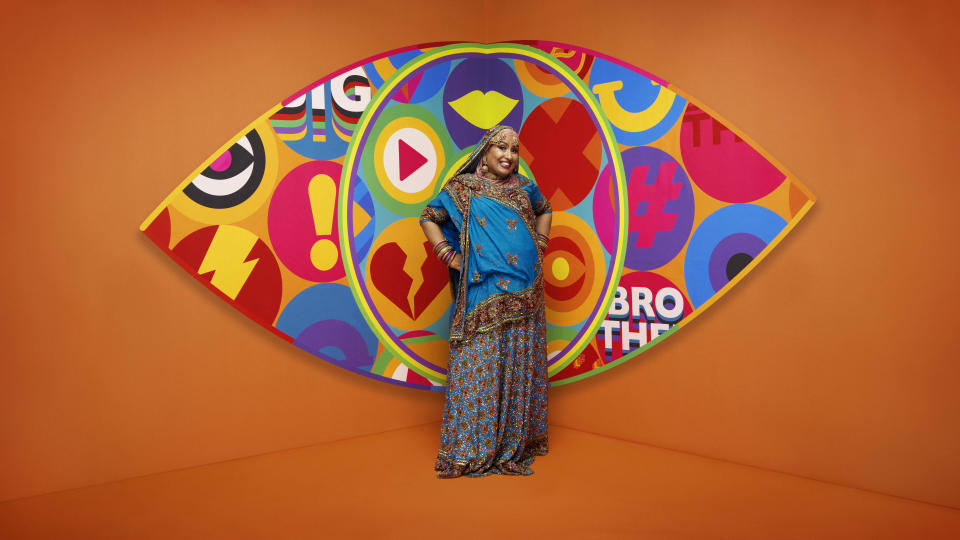 Farida pictured in front of the Big Brother logo.