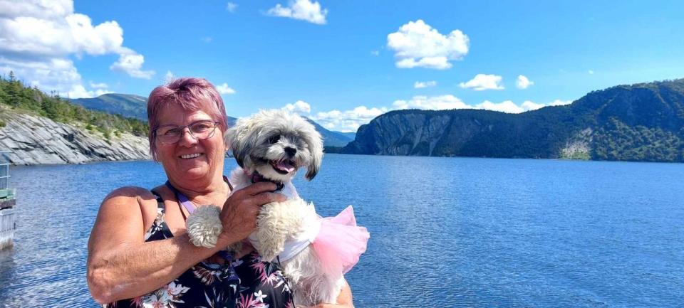 Auburtine and her dog enjoy the sights of what she called the trip of a lifetime in western Newfoundland. (Submitted by Alice Auburtine - image credit)
