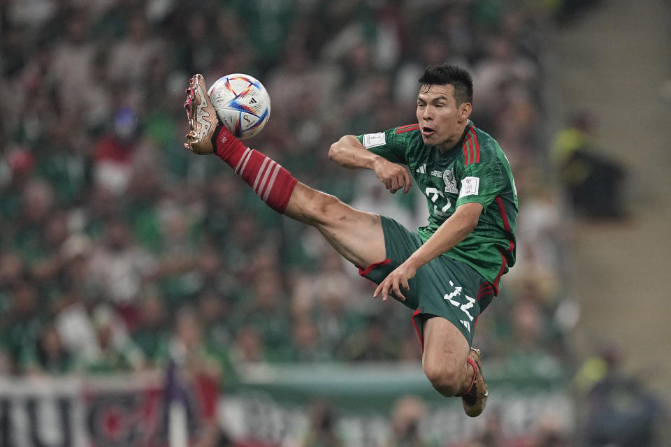 Mexico's Rogelio Funes Mori reaches fro the ball during the World Cup group C soccer match between Saudi Arabia and Mexico, at the Lusail Stadium in Lusail, Qatar, Wednesday, Nov. 30, 2022. (AP Photo/Ebrahim Noroozi)