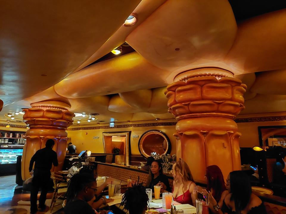 The interior of the Cheesecake Factory in Chicago on the Magnificent Mile. The photo shows tables of diners