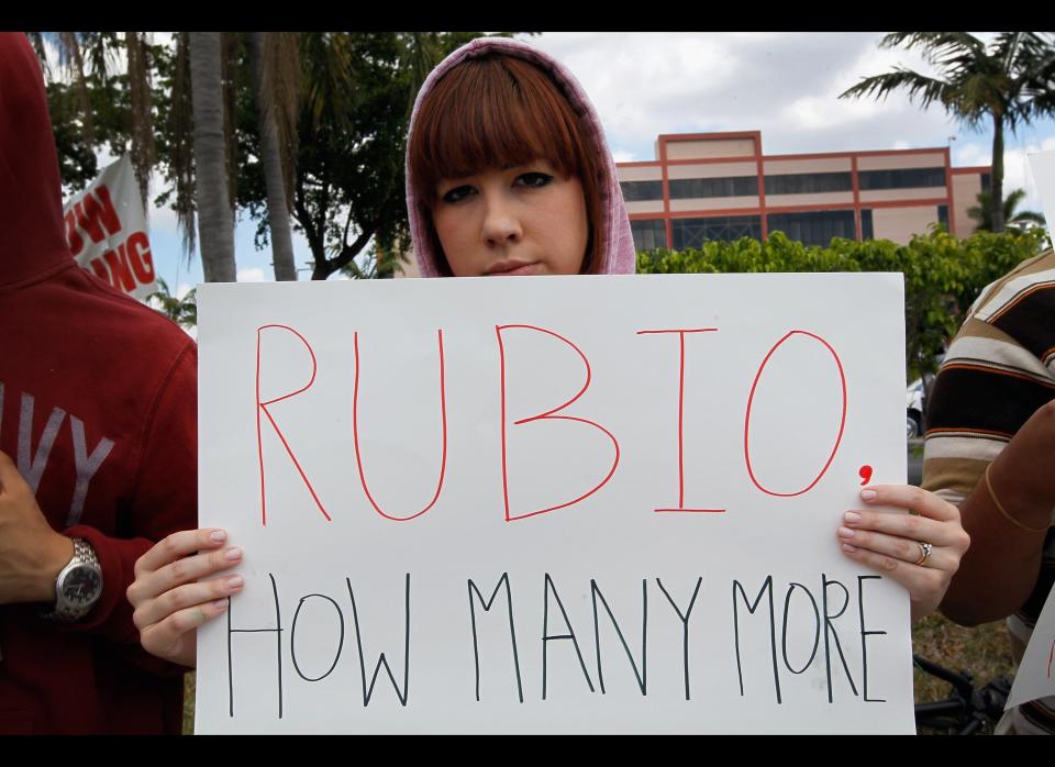 MIAMI, FL - APRIL 09:  Caterina De Quesada and other supporters of Trayvon Martin gather for a rally  in front of Florida Senator Marco Rubio's (R-FL) office to ask him to retract his support for Florida's so called 'Stand Your Ground' gun law following the Trayvon Martin killing on April 9, 2012 in Miami, Florida.  Martin was killed by George Michael Zimmerman on February 26th while Zimmerman was on neighborhood watch patrol in the gated community of The Retreat at Twin Lakes, Florida.  (Photo by Joe Raedle/Getty Images)