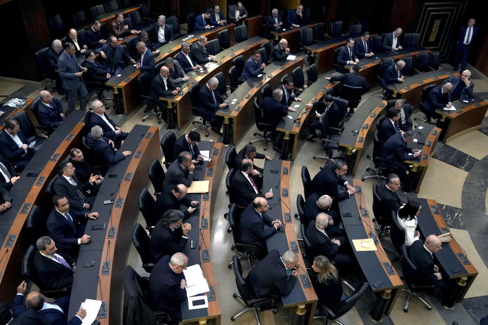 Lawmakers gather to elect a president at the parliament building in Beirut, Lebanon, Thursday, Jan. 19, 2023. The Lebanese pound's value Thursday hit an all-time low, now trading at 50,000 to the U.S. dollar, as the country's deeply-divided parliament failed to elect a president for an 11th time. (AP Photo/Bilal Hussein)