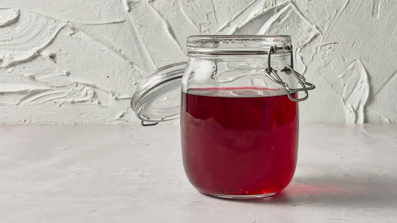 jar of cranberry vodka