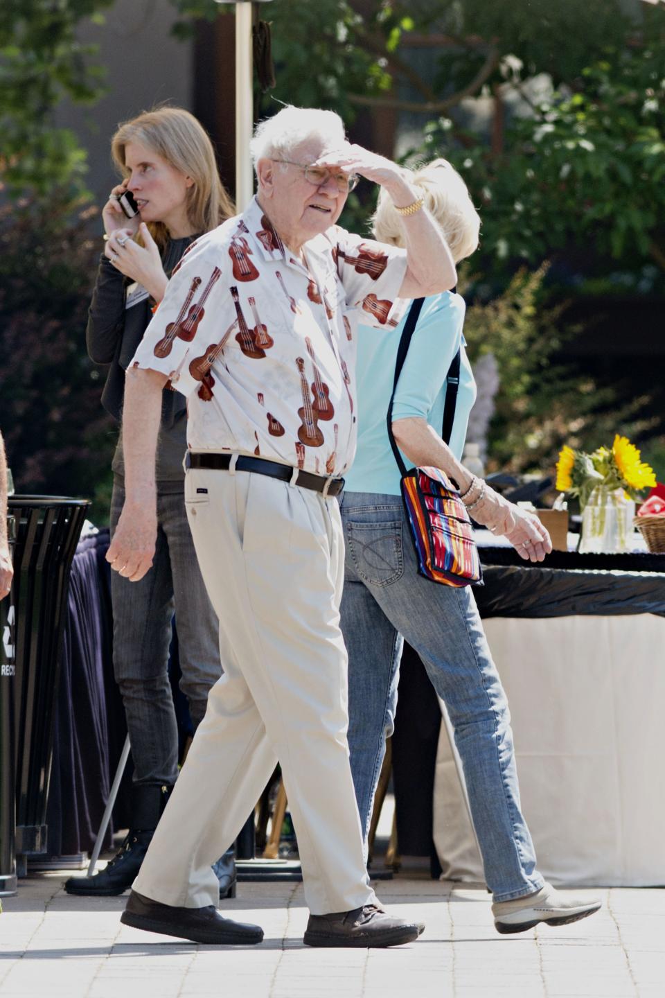 Another Sun Valley getup: a very wild guitar-print shirt with a subtle palm tree background.