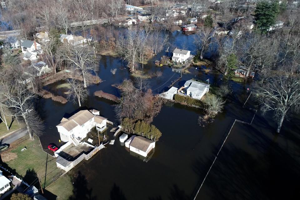 Homes remain flooded along the Pompton River in the southeastern section of Lincoln Park, NJ on Thursday Dec. 21, 2023.