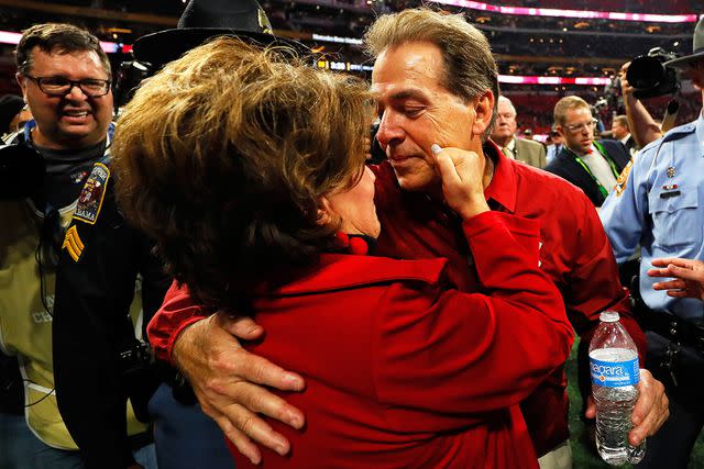 <p>Kevin C. Cox/Getty</p> Nick Saban and Terry Saban celebrate Alabama Crimson Tide win in January 2018.