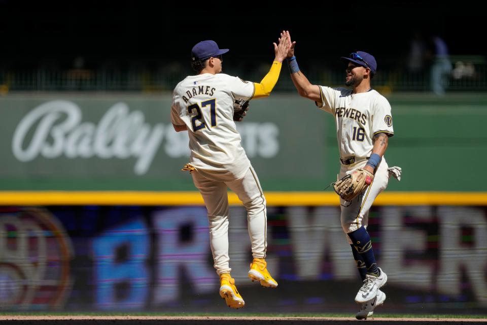 MILWAUKEE, WISCONSIN - MAY 01: Willy Adames #27 and Blake Perkins #16 of the Milwaukee Brewers celebrate after the Brewers defeated the Tampa Bay Rays 7-1 at American Family Field on May 01, 2024 in Milwaukee, Wisconsin. (Photo by Patrick McDermott/Getty Images)