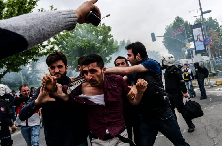 Turkish anti-riot police detain a protester during clashes at a May Day rally in Bakirkoy, a district of Istanbul, on May 1, 2016