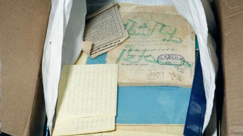 Boxes of evidence, including personal notes and video, were seized by British police.  