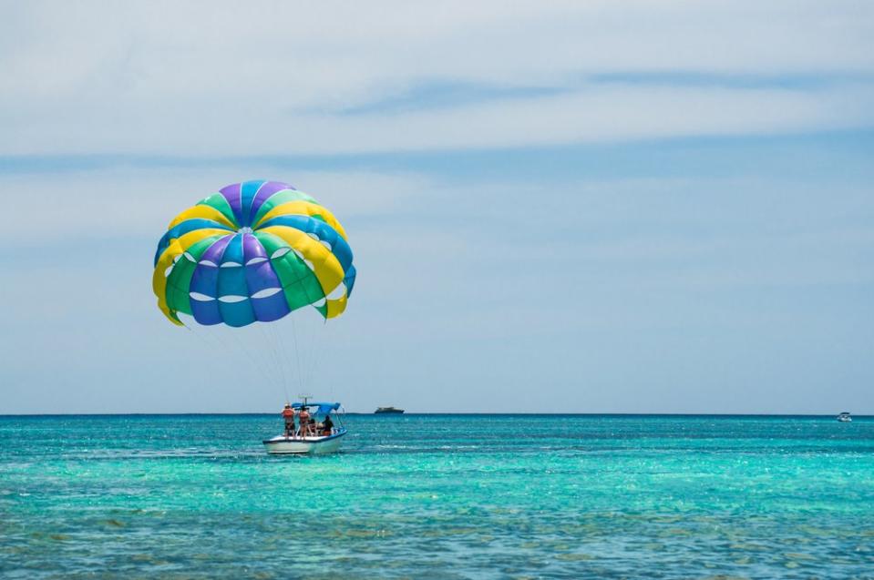 parasailing off a boat in Mexico