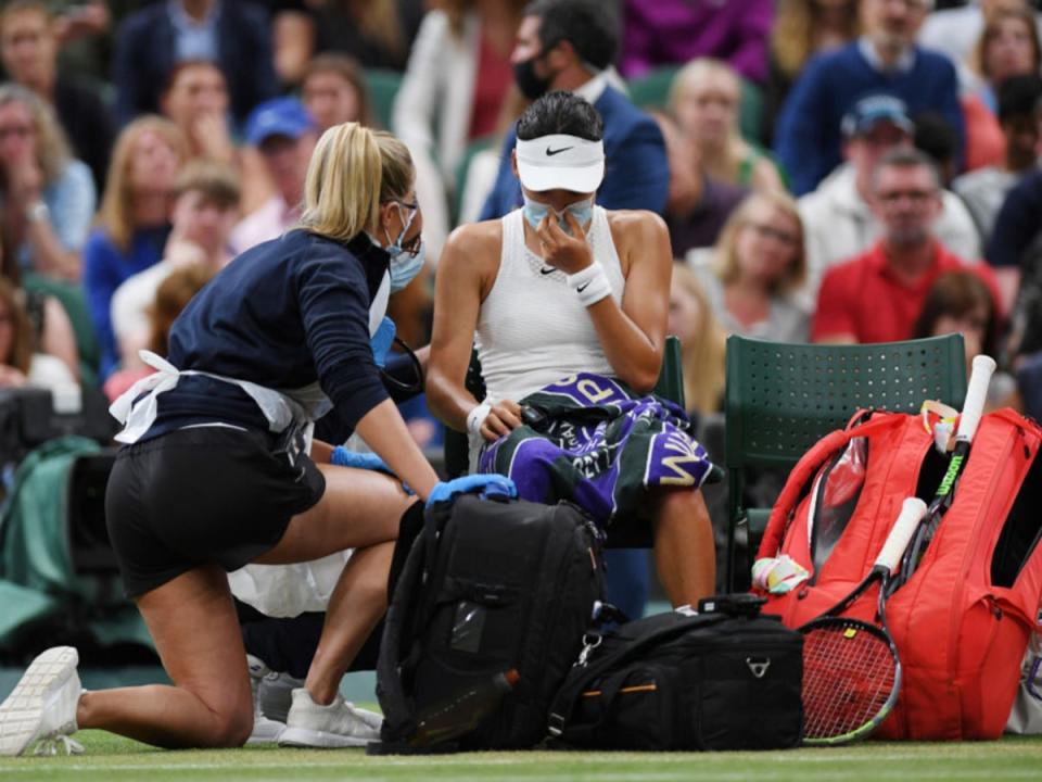 Emma Raducanu receives medical treatment during her match against Ajla Tomljanovic at Wimbledon last year  (Getty)