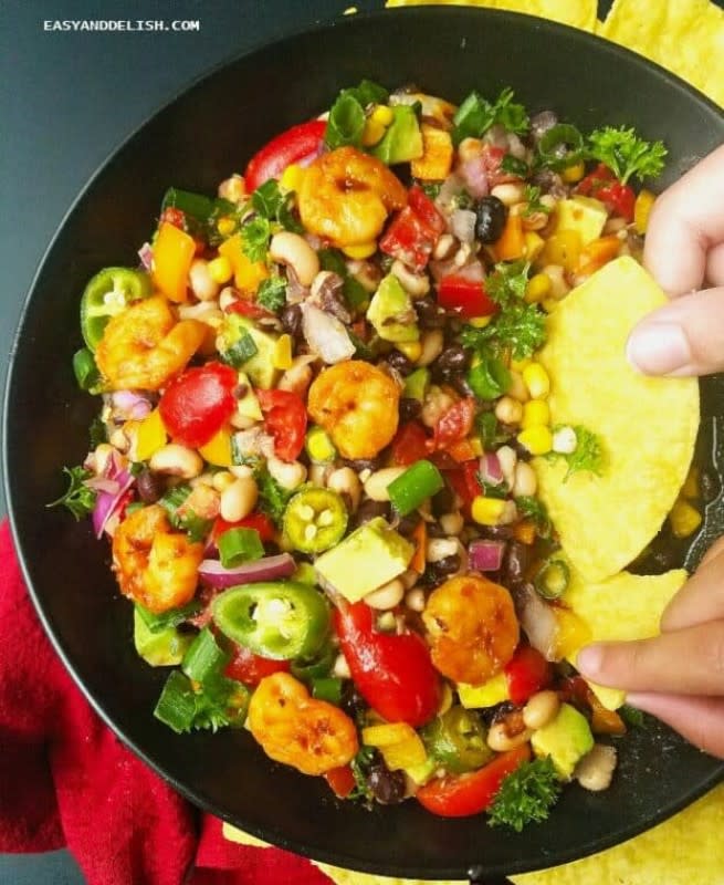 <p>The best Texas Caviar recipe, also known as cowboy caviar dip, tossed with shrimp, avocado and a spicy lime vinaigrette. You may serve as an appetizer or as a side for barbecued meats. <strong>Get the Recipe: <a href="https://www.easyanddelish.com/texas-caviar-recipe/" rel="nofollow noopener" target="_blank" data-ylk="slk:Texas Caviar Recipe;elm:context_link;itc:0;sec:content-canvas" class="link ">Texas Caviar Recipe</a></strong></p>