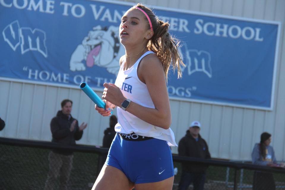 A Van Meter runner competes in the 4x800 relay during an invitational on Thursday, April 6, 2023, in Van Meter.