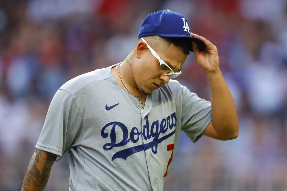 ATLANTA, GA - JUNE 24: Julio Urias #7 of the Los Angeles Dodgers returns to the dugout during the third inning against the Atlanta Braves at Truist Park on June 24, 2022 in Atlanta, Georgia. (Photo by Todd Kirkland/Getty Images)