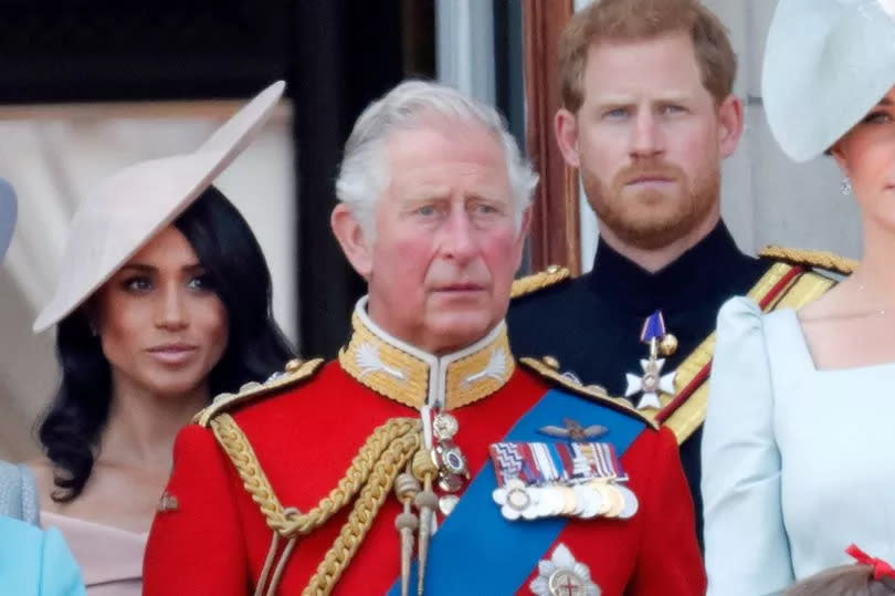 Meghan, Duchess of Sussex, Prince Charles, Prince of Wales and Prince Harry, Duke of Sussex stand on the balcony of Buckingham Palace during Trooping The Colour 2018 on June 9, 2018 in London, England. The annual ceremony involving over 1400 guardsmen and cavalry, is believed to have first been performed during the reign of King Charles II. The parade marks the official birthday of the Sovereign, even though the Queen's actual birthday is on April 21st.