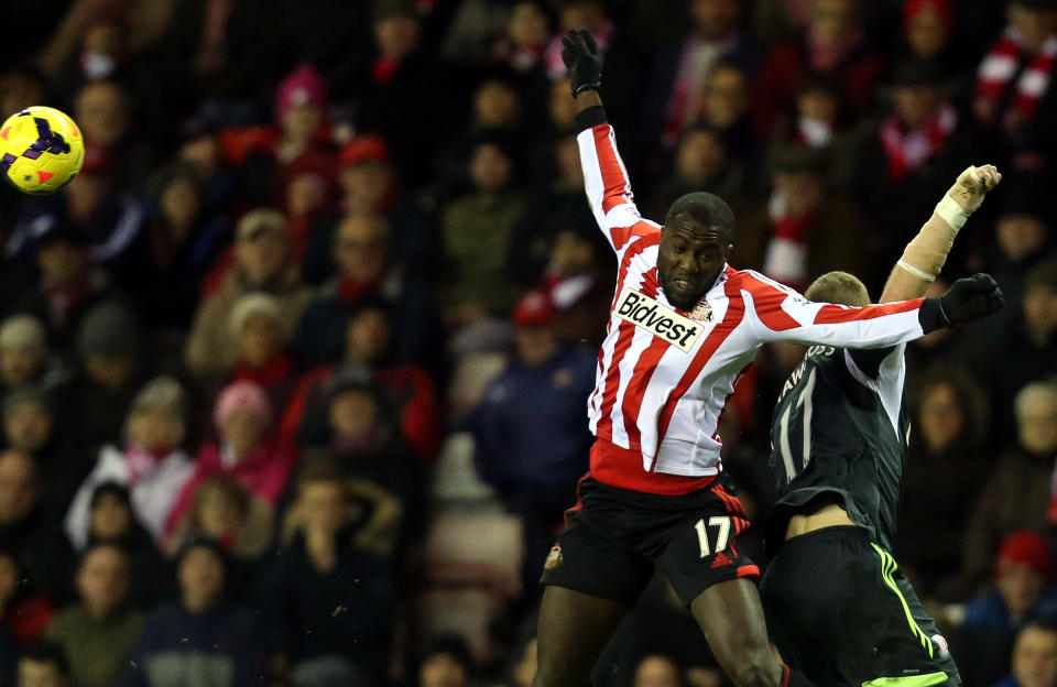Sunderland's Jozy Altidore, second right, vies for the ball with Stoke City's captain Ryan Shawcross, during their English Premier League soccer match at the Stadium of Light, Sunderland, England, Wednesday, Jan. 29, 2014. (AP Photo/Scott Heppell)